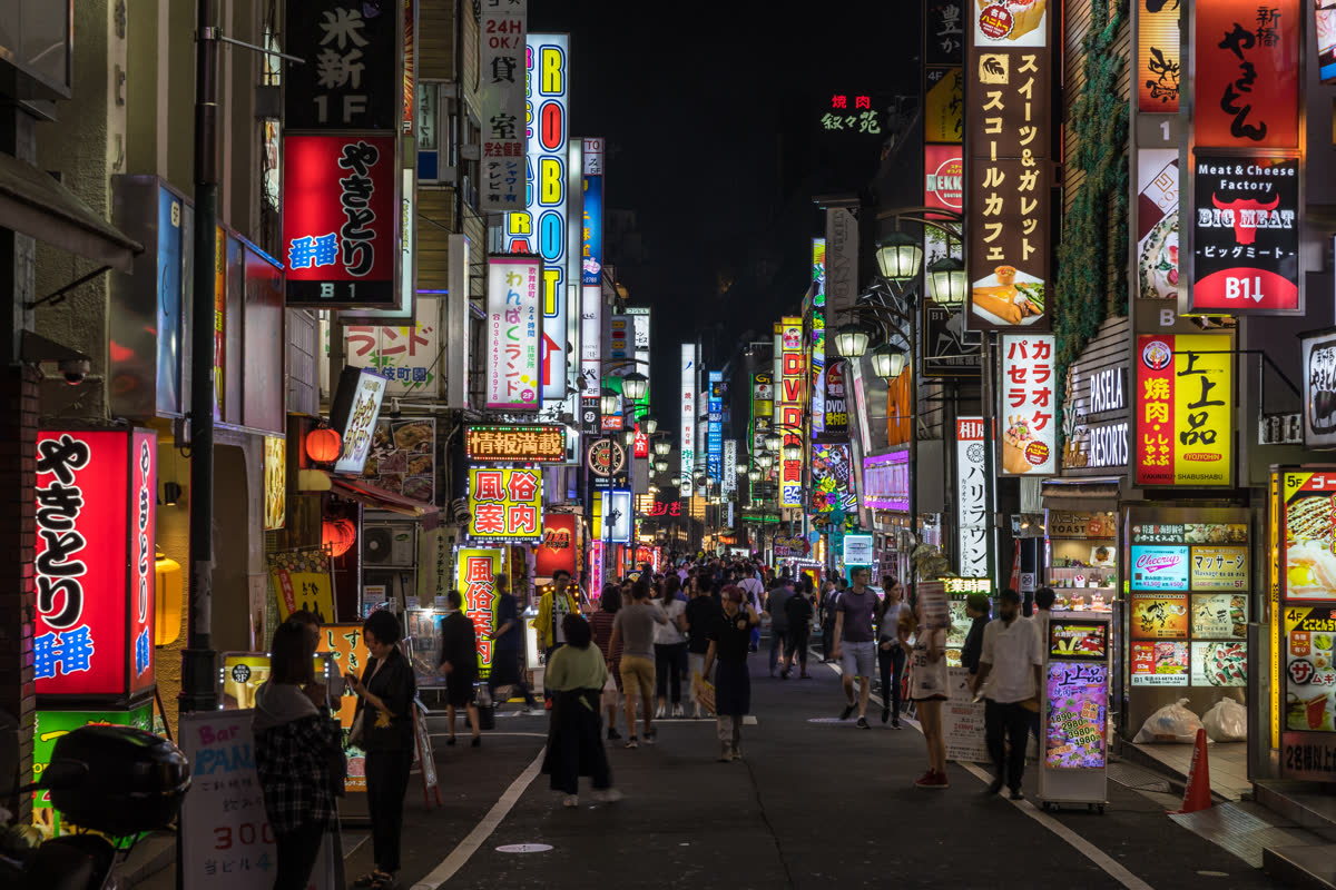 Neon-lit Tokyo street at night